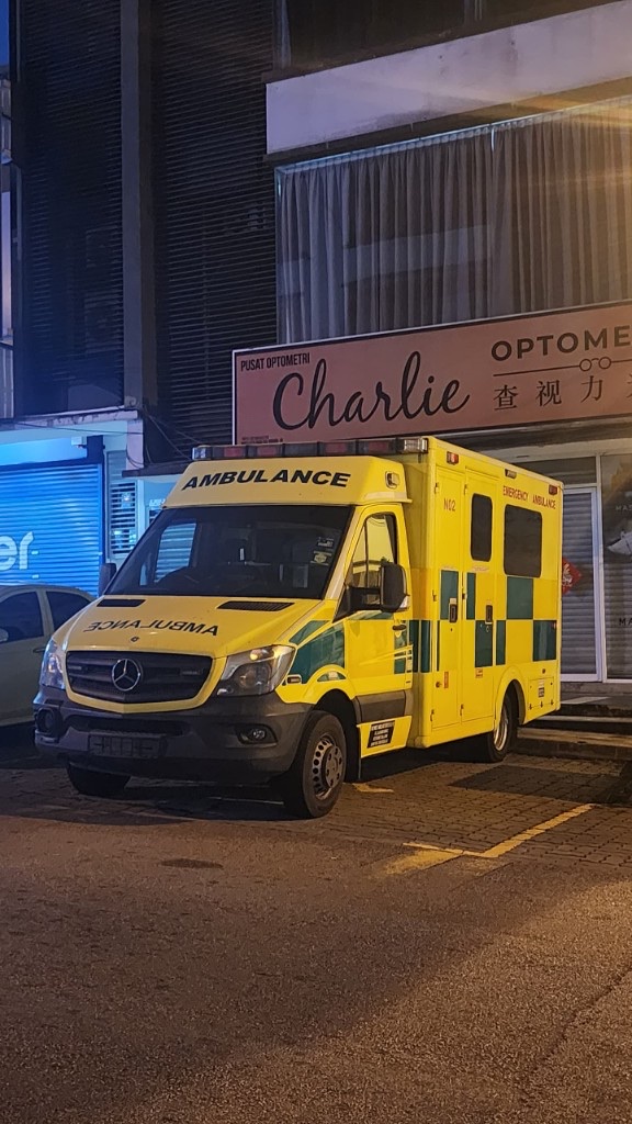 Yellow emergency ambulance at night